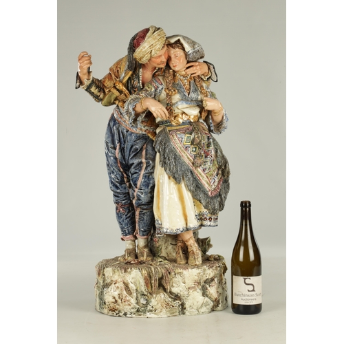 110 - A LATE 19TH CENTURY ITALIAN VIENNESE FAIENCE GOLDSHEIDER FIGURE GROUP OF LARGE SIZE depicting two lo... 