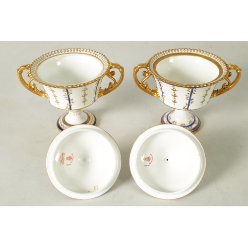 112 - A FINE PAIR OF ROYAL CROWN DERBY CAMPANA SHAPED TWO-HANDLED PEDESTAL VASES AND COVERS with richly gi... 