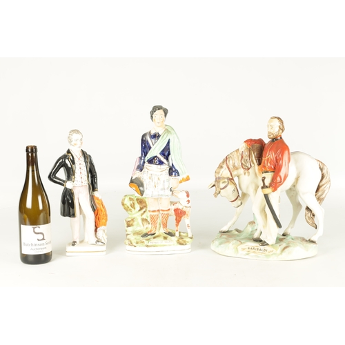 114 - THREE 19TH CENTURY STAFFORDSHIRE FIGURES of Garibaldi, Prince of Wales, and Wellington (39cm high )