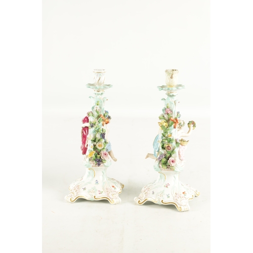 115 - A PAIR OF 19TH CENTURY MEISSEN PORCELAIN CANDELABRA with scrolled branch work supports having mounte... 