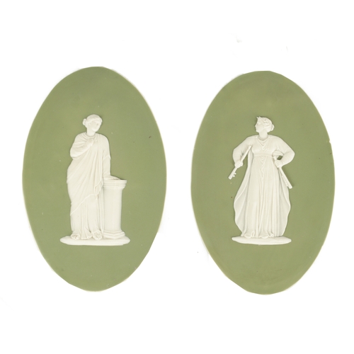 117 - A PAIR OF LATE 19TH CENTURY WEDGWOOD PALE GREEN OVAL JASPER WARE PANELS with raised decoration of cl... 