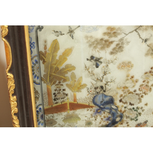 121 - A PAIR OF 19TH CENTURY CHINESE REVERSE PAINTED LANDSCAPE SCENES ON GLASS WITH MIRRORED EFFECT depict... 