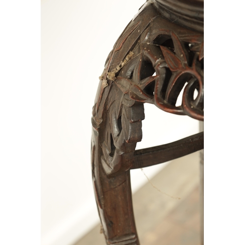 125 - A 19TH CENTURY CHINESE HARDWOOD JARDINIERE STAND with an inset marble top above a faux bamboo carved... 