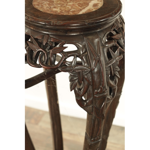 125 - A 19TH CENTURY CHINESE HARDWOOD JARDINIERE STAND with an inset marble top above a faux bamboo carved... 