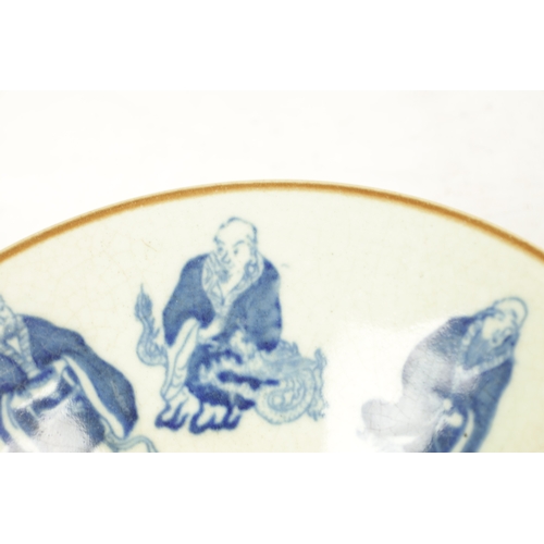 127 - A CHINESE CELEDON AND BLUE SHAPED BOWL decorated with buddhas - signed with six character mark benea... 