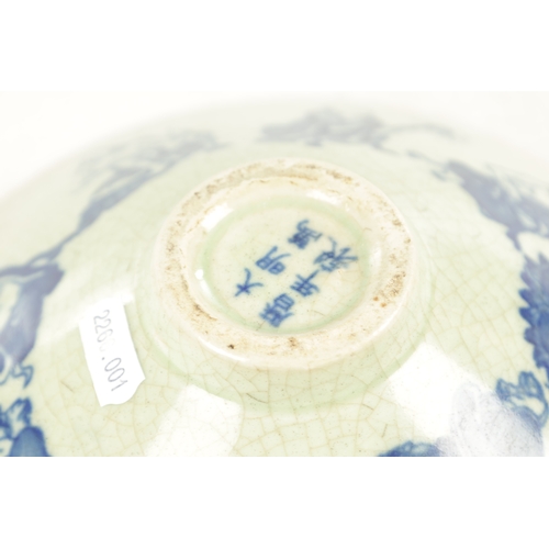 127 - A CHINESE CELEDON AND BLUE SHAPED BOWL decorated with buddhas - signed with six character mark benea... 