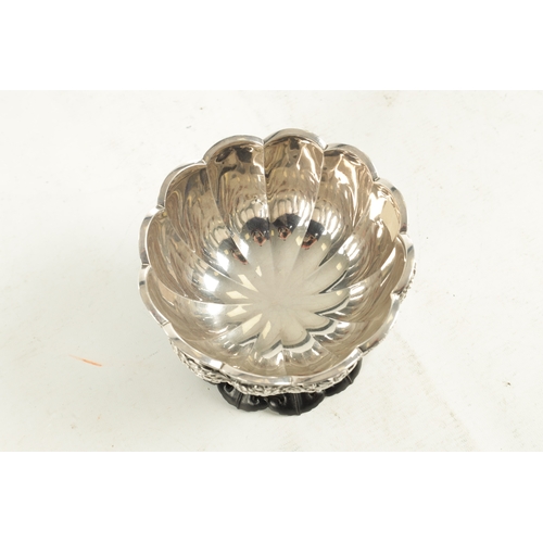 129 - A FINE 19TH CENTURY JAPANESE SILVER BOWL having relief floral decoration - signed underneath, mounte... 