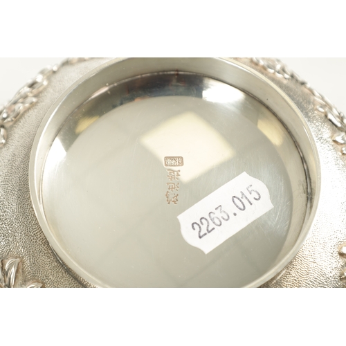 129 - A FINE 19TH CENTURY JAPANESE SILVER BOWL having relief floral decoration - signed underneath, mounte... 