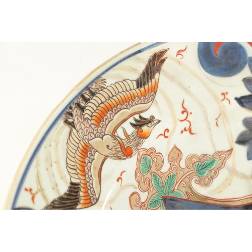 134 - A 17TH CENTURY JAPANESE IMARI CHARGER with polychrome panelled decoration (55cm diameter)