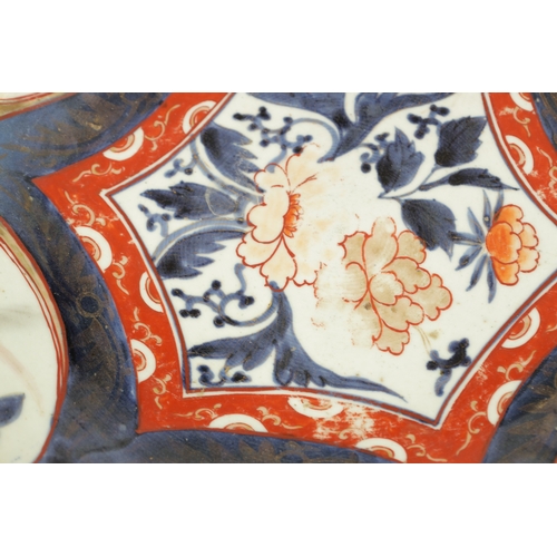 134 - A 17TH CENTURY JAPANESE IMARI CHARGER with polychrome panelled decoration (55cm diameter)