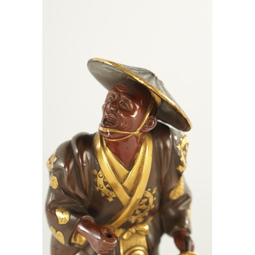 136 - A 19TH CENTURY JAPANESE MEIJI PERIOD BRONZE FIGURAL OKIMONO of two-tone mixed metal finish depicting... 