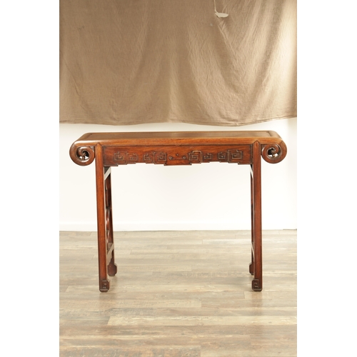 137 - A LATE 19TH CENTURY CHINESE HARDWOOD ALTAR TABLE POSSIBLY HUANGHUALI WOOD having a panelled top with... 