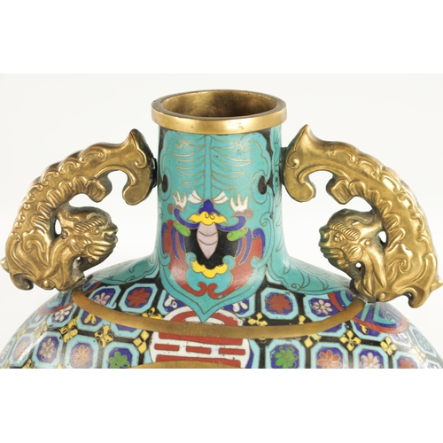 138 - A PAIR OF CHINESE CLOISONNE ENAMEL MOON FLASKS with dragon handles and geometric borders enclosing c... 