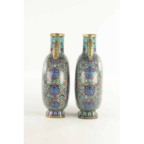 138 - A PAIR OF CHINESE CLOISONNE ENAMEL MOON FLASKS with dragon handles and geometric borders enclosing c... 