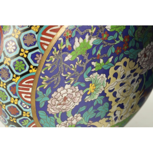 138 - A PAIR OF CHINESE CLOISONNE ENAMEL MOON FLASKS with dragon handles and geometric borders enclosing c... 