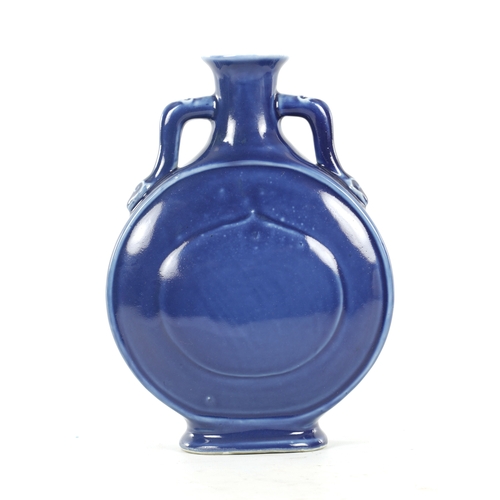 147 - A 19TH CENTURY BLUE GLAZED CHINESE MOON FLASK with double ear handles and character seal mark beneat... 