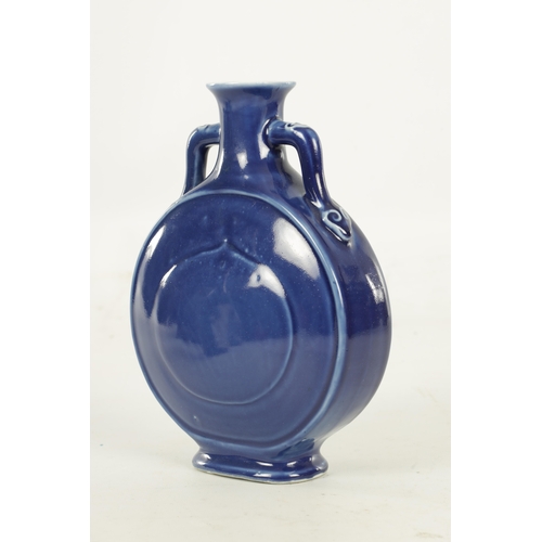 147 - A 19TH CENTURY BLUE GLAZED CHINESE MOON FLASK with double ear handles and character seal mark beneat... 