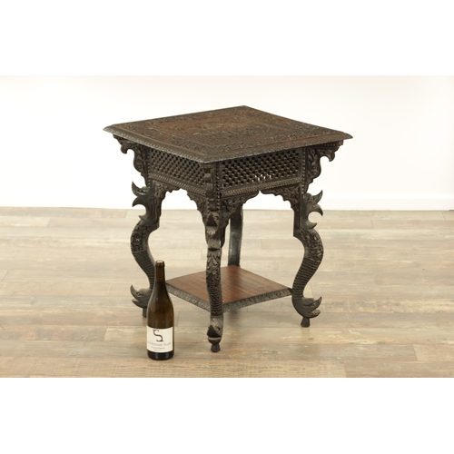 149 - A LATE 19TH CENTURY ANGLO INDIAN TWO TIER HARDWOOD OCCASIONAL TABLE the carved square top with centr... 