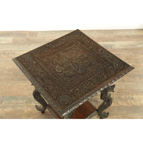 149 - A LATE 19TH CENTURY ANGLO INDIAN TWO TIER HARDWOOD OCCASIONAL TABLE the carved square top with centr... 