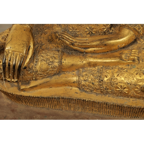 151 - A LARGE 19TH CENTURY GILT METAL TIBETAN BUDDHA with canopy and stepped base (85cm high )