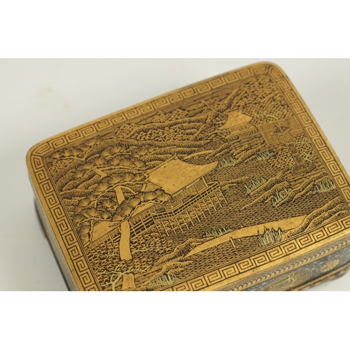 152 - A FINE JAPANESE MEIJI GILT AND SILVERED IRONWORK BOX BY KOMAI the lift-off lid with a finely engrave... 