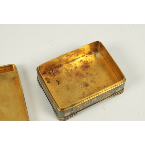 152 - A FINE JAPANESE MEIJI GILT AND SILVERED IRONWORK BOX BY KOMAI the lift-off lid with a finely engrave... 