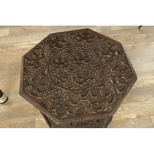 153 - A GOOD 19TH CENTURY INDIAN CARVED HARDWOOD OCTAGONAL CENTRE TABLE with deep finely carved panelled l... 