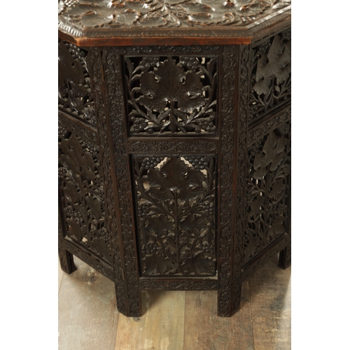 153 - A GOOD 19TH CENTURY INDIAN CARVED HARDWOOD OCTAGONAL CENTRE TABLE with deep finely carved panelled l... 