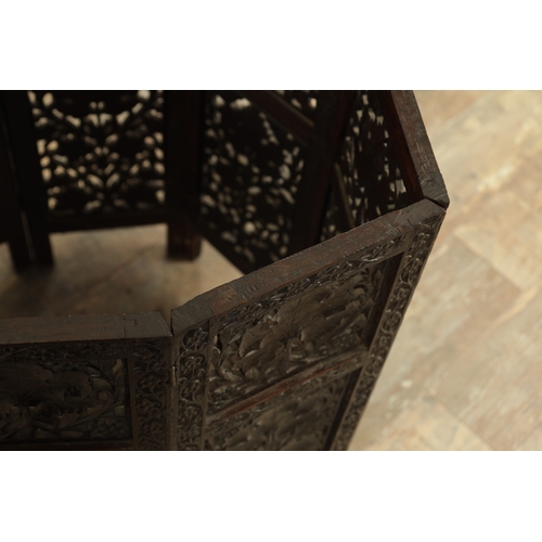 153 - A GOOD 19TH CENTURY INDIAN CARVED HARDWOOD OCTAGONAL CENTRE TABLE with deep finely carved panelled l... 