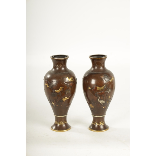 155 - A PAIR OF JAPANESE MEIJI PERIOD MIXED METAL BRONZE VASES finely decorated with birds amongst flowers... 