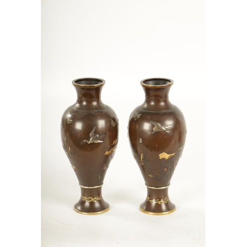 155 - A PAIR OF JAPANESE MEIJI PERIOD MIXED METAL BRONZE VASES finely decorated with birds amongst flowers... 