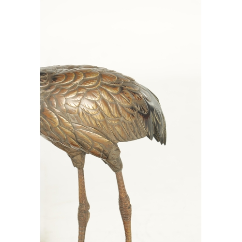 160 - A GOOD PAIR OF JAPANESE MEIJI PERIOD COLD PAINTED BRONZE SCULPTURES OF CRANES on hardwood bases (one... 