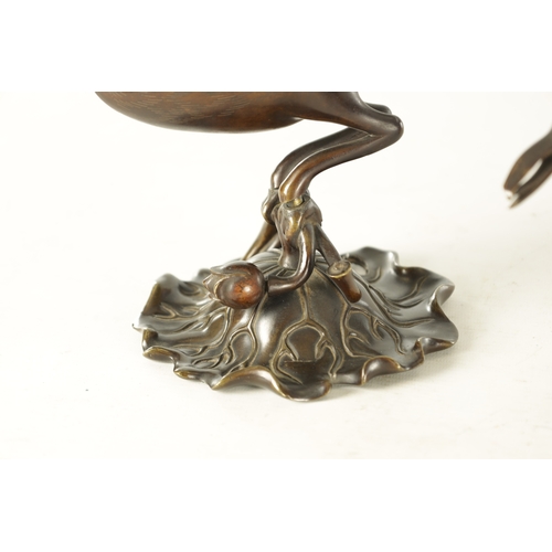 161 - A PAIR OF MEIJI PERIOD JAPANESE BRONZE AND MIXED METAL CENSERS modelled as two cranes perched on lil... 