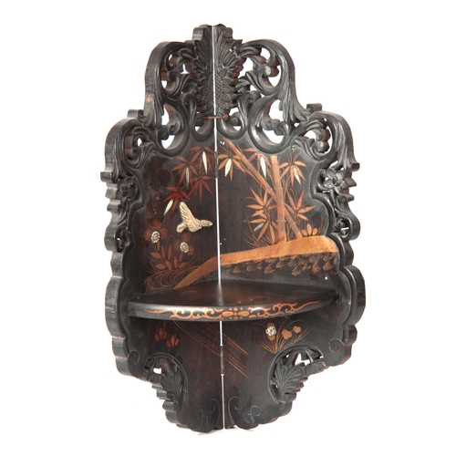 162 - A LATE 19TH CENTURY ORIENTAL EBONISED, BONE INLAID AND LACQUERWORK HANGING CORNER SHELVES with scrol... 