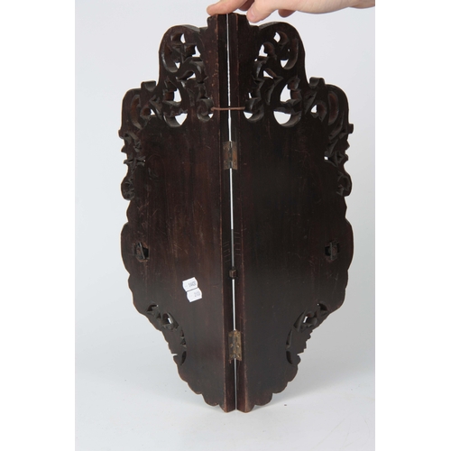 162 - A LATE 19TH CENTURY ORIENTAL EBONISED, BONE INLAID AND LACQUERWORK HANGING CORNER SHELVES with scrol... 