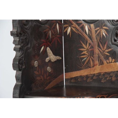 162 - A LATE 19TH CENTURY ORIENTAL EBONISED, BONE INLAID AND LACQUERWORK HANGING CORNER SHELVES with scrol... 