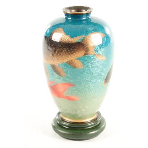 164 - A JAPANESE MEIJI PERIOD CLOISONNÉ ENAMEL VASE DECORATED WITH CARP on a blue ground bearing signature... 