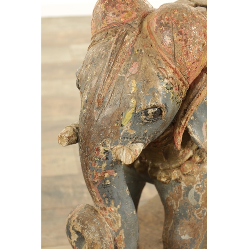 171 - A LARGE PAIR OF 19TH CENTURY INDIAN CARVED POLYCHROME PAINTED SCULPTURES OF ELEPHANTS mounted on ova... 