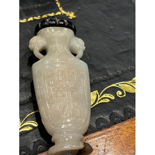 180 - A GOOD 19TH CENTURY CHINESE CARVED WHITE JADE SNUFF BOTTLE formed as an urn with foo dog side handle... 