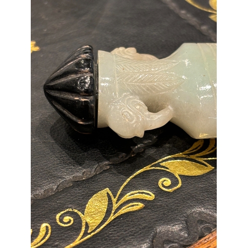 180 - A GOOD 19TH CENTURY CHINESE CARVED WHITE JADE SNUFF BOTTLE formed as an urn with foo dog side handle... 