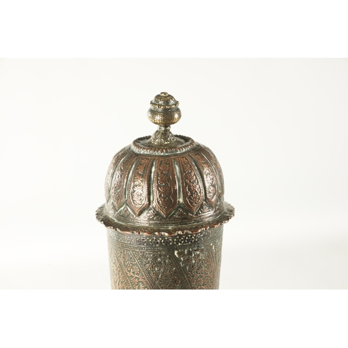 181 - A 19TH CENTURY INDIAN COPPER SILVER PLATED LIDDED VASE with embossed floral all-over decoration. (51... 