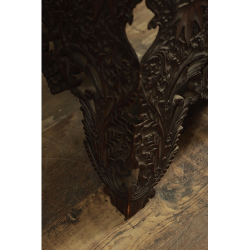 183 - A LATE 19TH CENTURY ANGLO INDIAN HARDWOOD OCCASIONAL TABLE the shaped square top carved with maple l... 