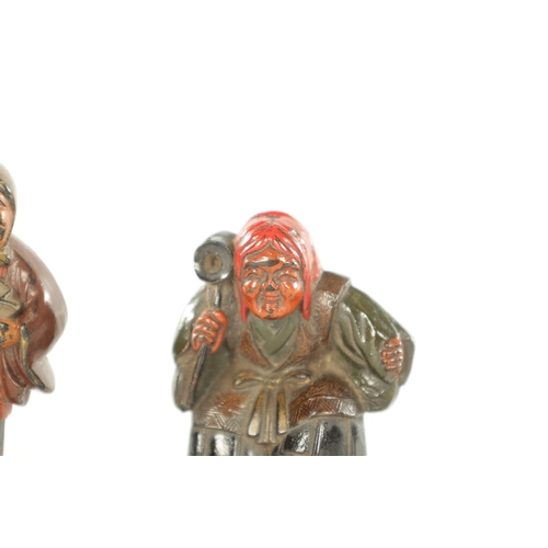 184 - TWO JAPANESE CARVED BOXWOOD NETSUKE depicting two figures painted in polychrome colours (5cm and 4cm... 