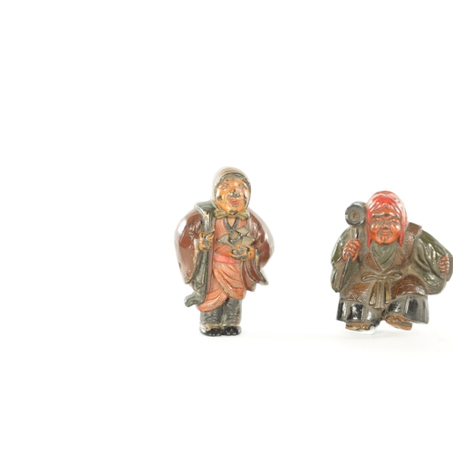 184 - TWO JAPANESE CARVED BOXWOOD NETSUKE depicting two figures painted in polychrome colours (5cm and 4cm... 