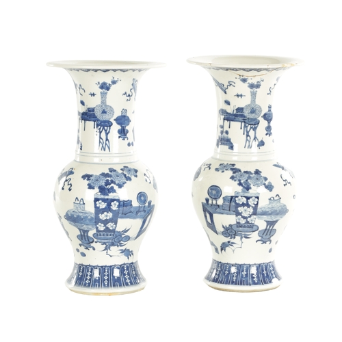 185 - A PAIR OF 18TH / 19TH CENTURY CHINESE BLUE AND WHITE VASES of bulbous shape with flared necks decora... 