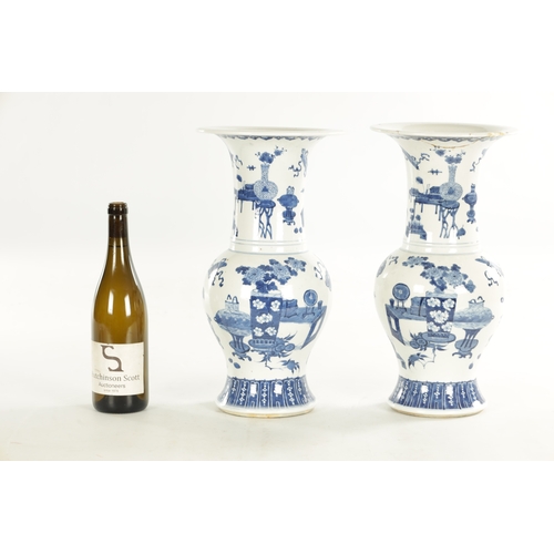 185 - A PAIR OF 18TH / 19TH CENTURY CHINESE BLUE AND WHITE VASES of bulbous shape with flared necks decora... 