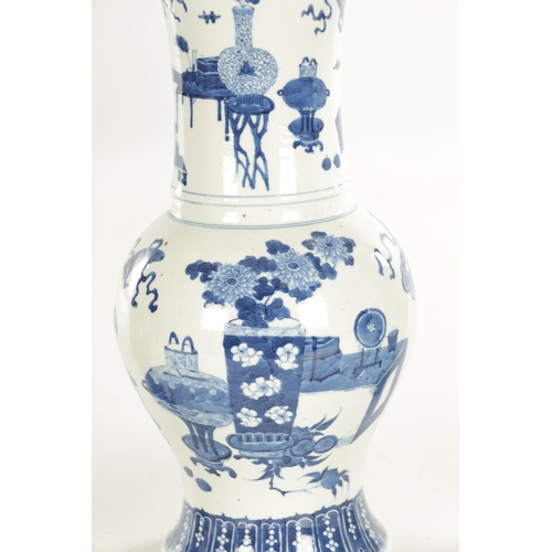 185 - A PAIR OF 18TH / 19TH CENTURY CHINESE BLUE AND WHITE VASES of bulbous shape with flared necks decora... 