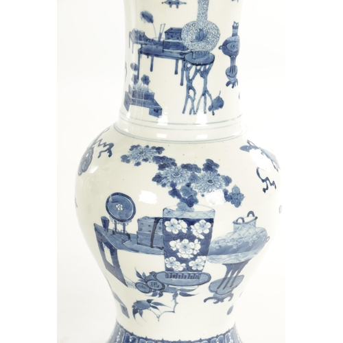 185 - A PAIR OF 18TH / 19TH CENTURY CHINESE BLUE AND WHITE VASES of bulbous shape with flared necks decora... 