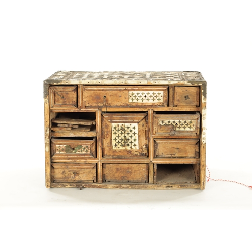 186 - A 17TH CENTURY INDO PORTUGUESE INLAID BONE TABLE CABINET IN NEED OF RESTORATION with all-around peta... 