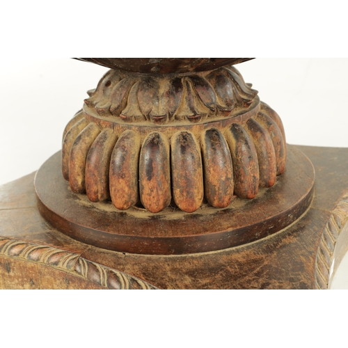 192 - AN UNUSUAL REGENCY ANGLO INDIAN CARVED HARDWOOD JARDINIERE with gadrooned leaf carved body raised on... 